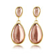 Elegante Gouden Oorbellen met Roze Druppelsteen Elegante Gouden Oorbellen met Roze Druppelsteen