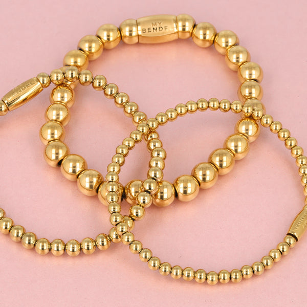 Gouden kralenarmbanden set