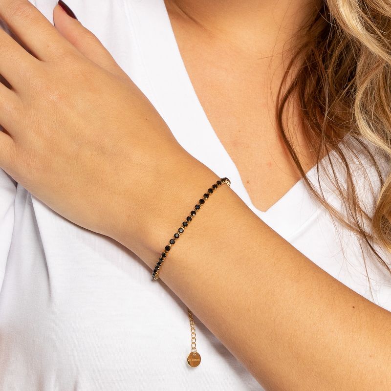 Gouden tennisarmband met zwarte zirkonia stenen