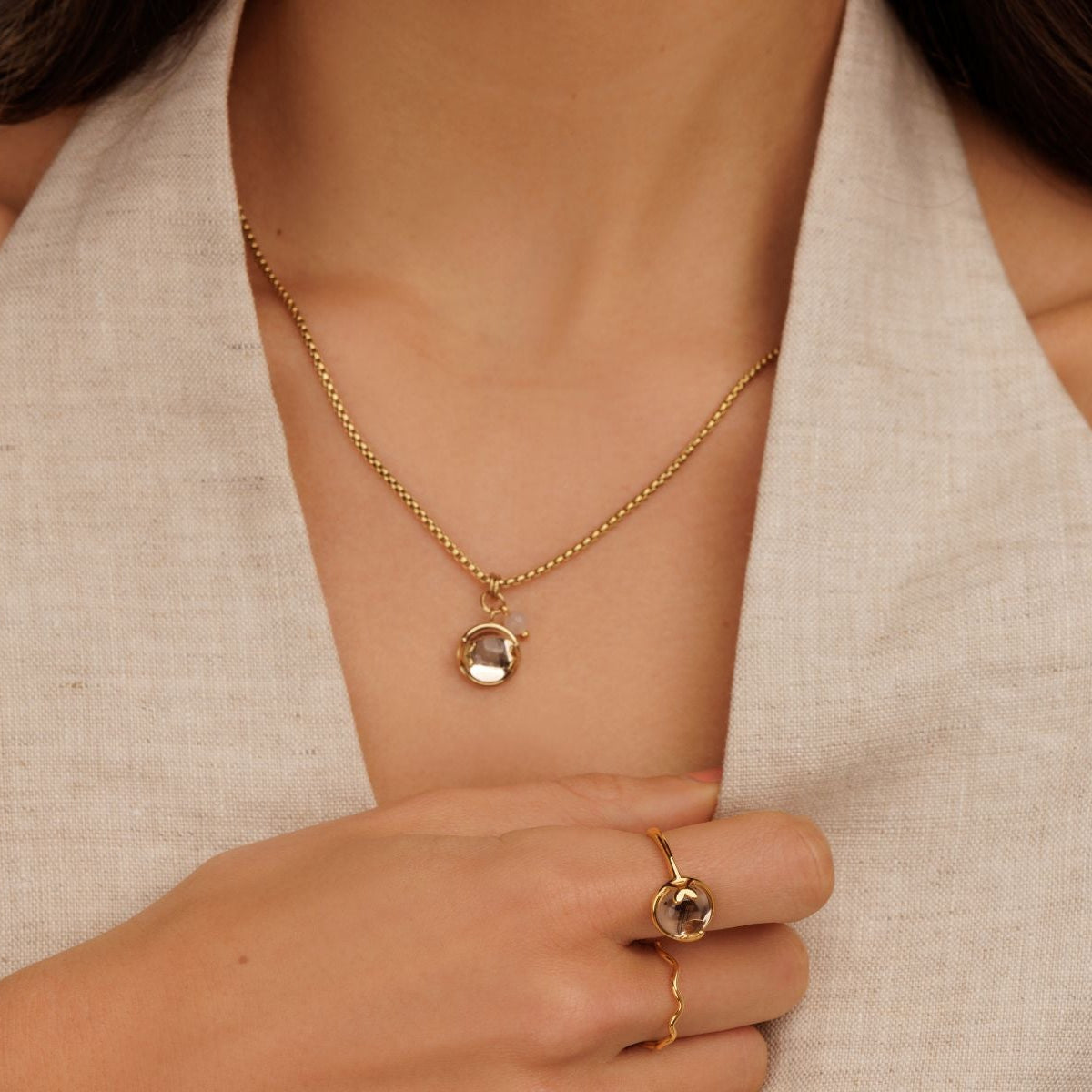 Ring with Heart Detail and Round Glass Stone • Champagne