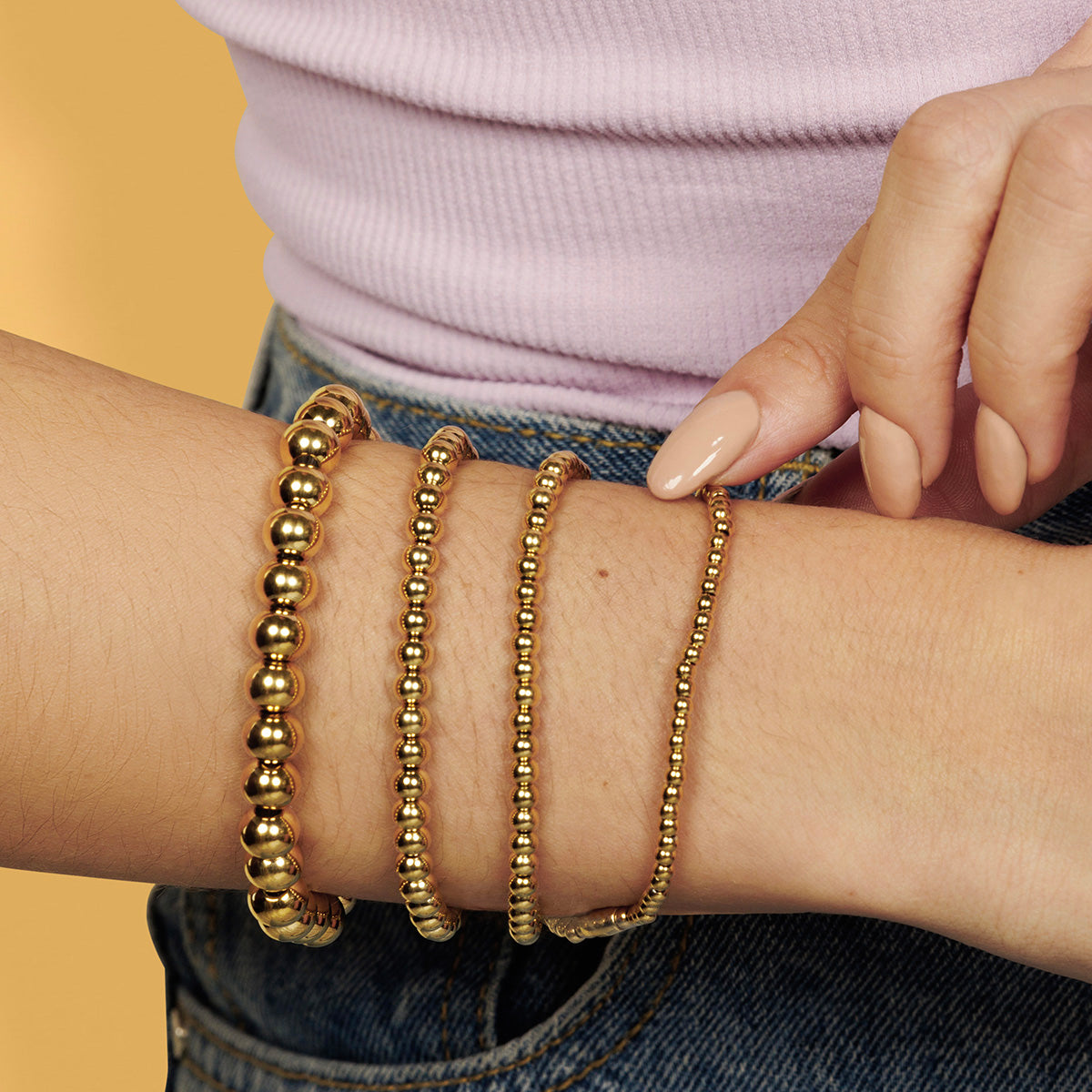 Gouden kralenarmbanden set