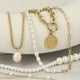 Double chain with large and small white pearls
