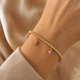 Elastisches Armband mit runden Edelsteinanhängern • Rhodonit