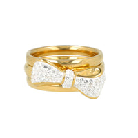 Sprankelende gouden ringenset met strik.