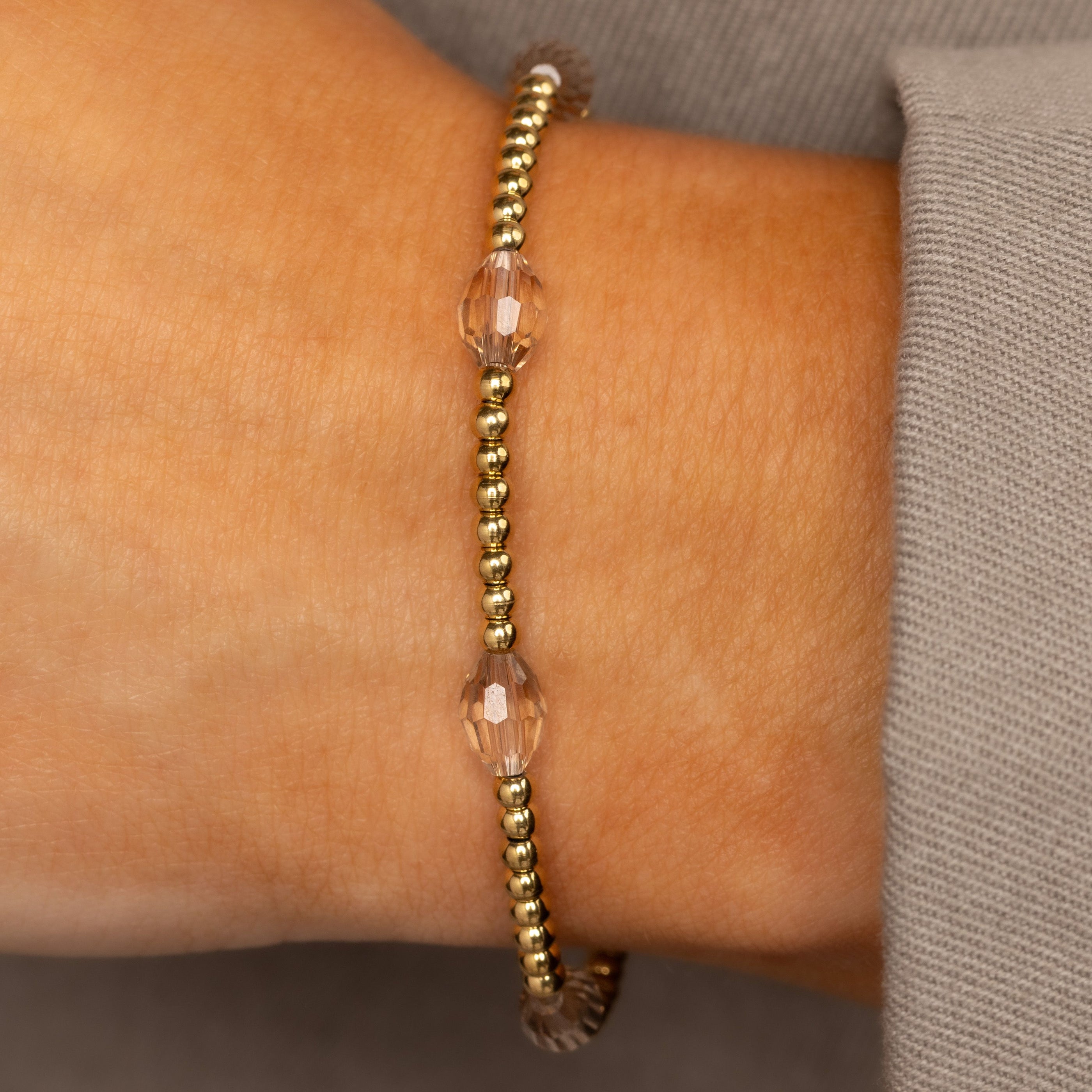 Armband mit facettierten ovalen Perlen • Champagner