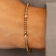 Armband mit facettierten ovalen Perlen • Champagner