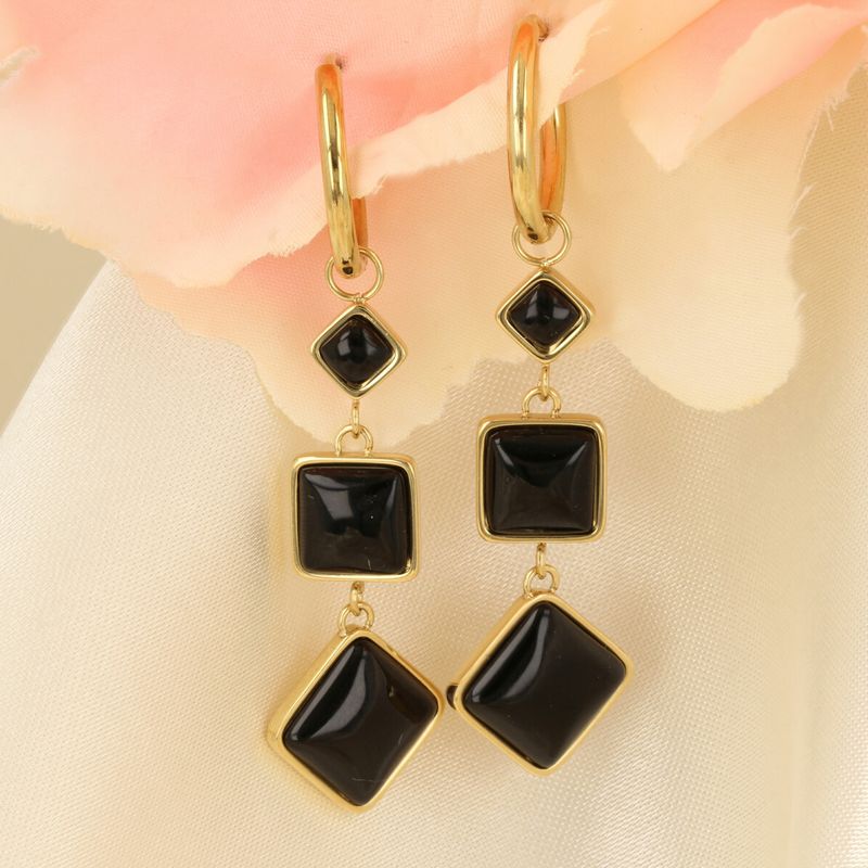 Elegant Gold Earring with Three Onyx Gemstones