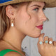 Golden Oval Earrings with Pear-Shaped White Quartz Pendant