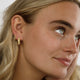 Radiant Golden Earrings with Elegant Ribs