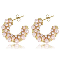 Elegante goldene Ohrringe mit rosa Perle