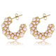 Elegante goldene Ohrringe mit rosa Perle