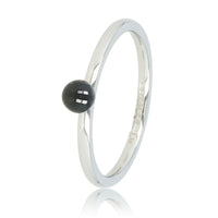 Silver stacking ring with ceramic bead.