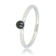 Silver stacking ring with ceramic bead.