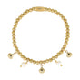 Gold charm bracelet with pearls and shells