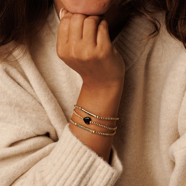 Elastische Onyx Armband met Hart bedel