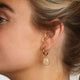 Elegant Gold Earrings with Rose Quartz Pendant