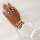 Gold Bracelet with White Pearls and Knot Detail