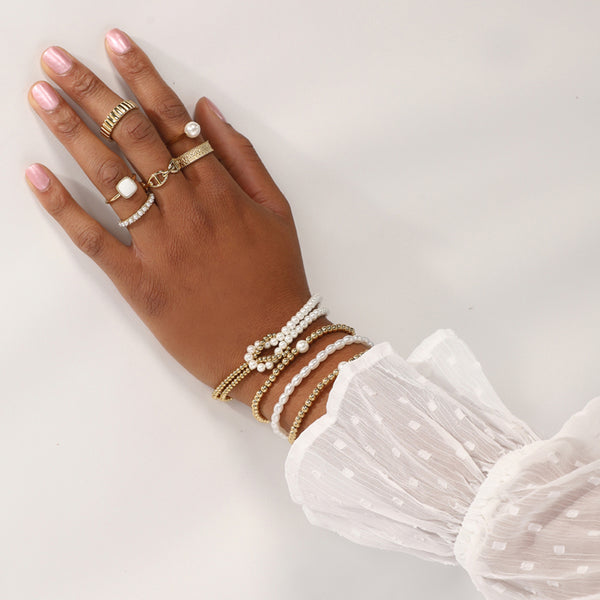 Gouden Armband met Witte Parels - Stijlvol Accessoire