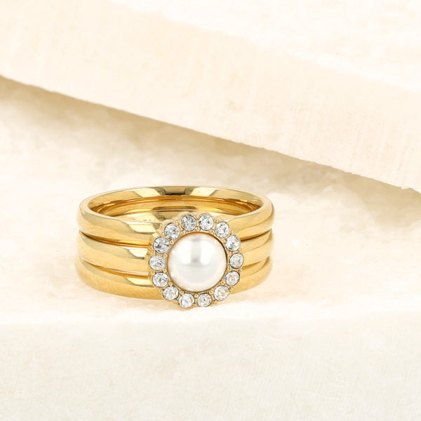 Gouden ringenset met witte parel en zirkonia stenen. Inclusief 2 gladde aanschuifringen. 1 jaar garantie.