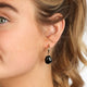 Onyx Elegance: Golden Earrings with Stylish Pendant