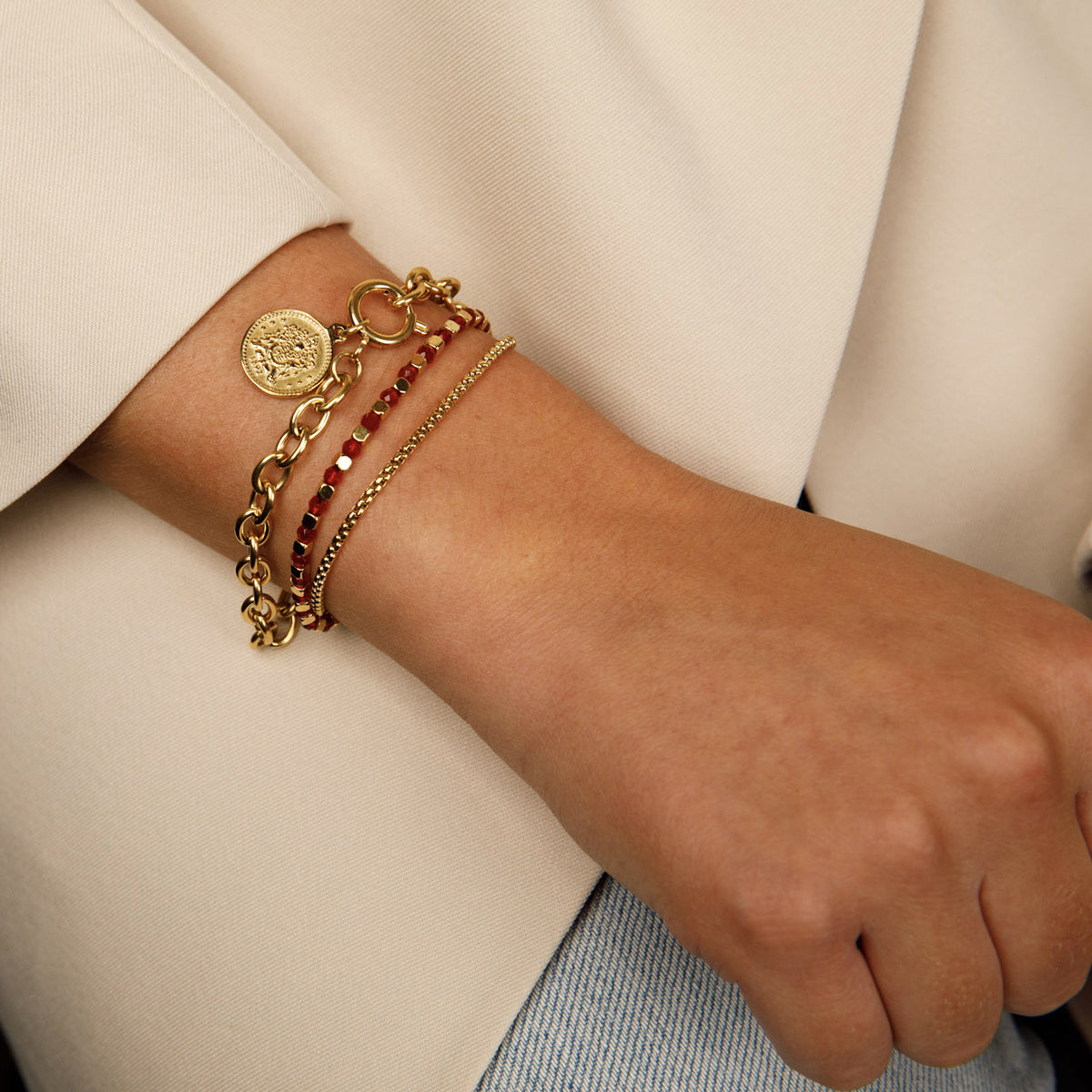Golden Bracelet with Red Glass Stones - Elegant Design