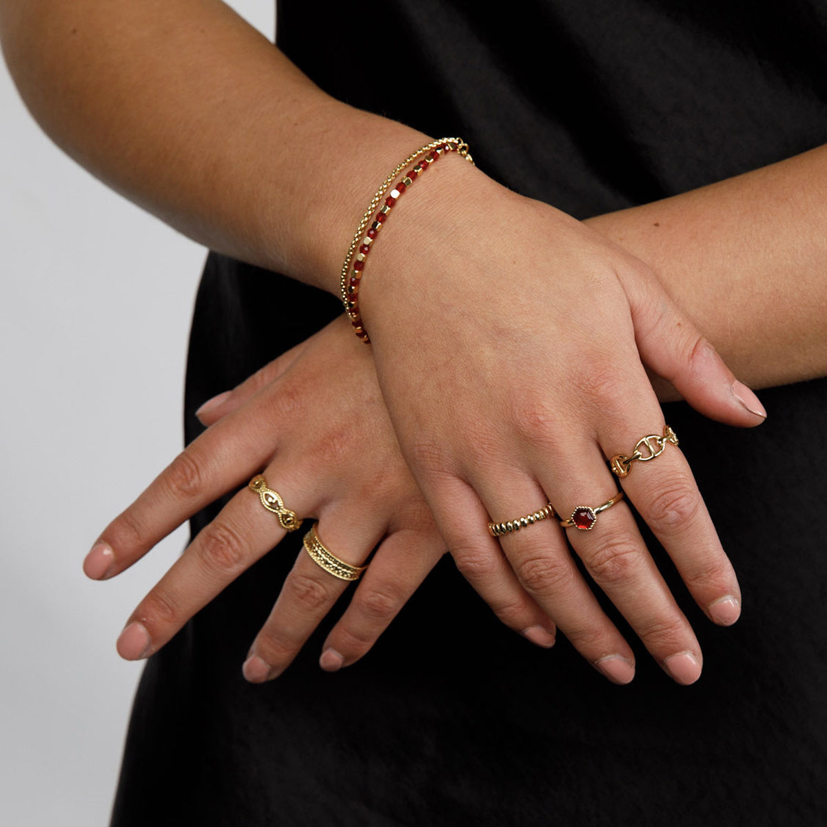 Golden Bracelet with Red Glass Stones - Elegant Design