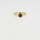 Gold ring with black glass stone - Twisted edge