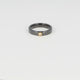 Schwarzer Keramikring mit Goldakzent und Zirkonia