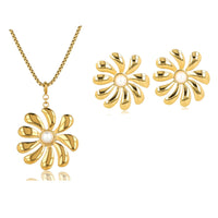 Elegant gold flower set with necklace and earrings. Large flower pendant and radiant pearls. Perfect for any occasion. My Bendel.