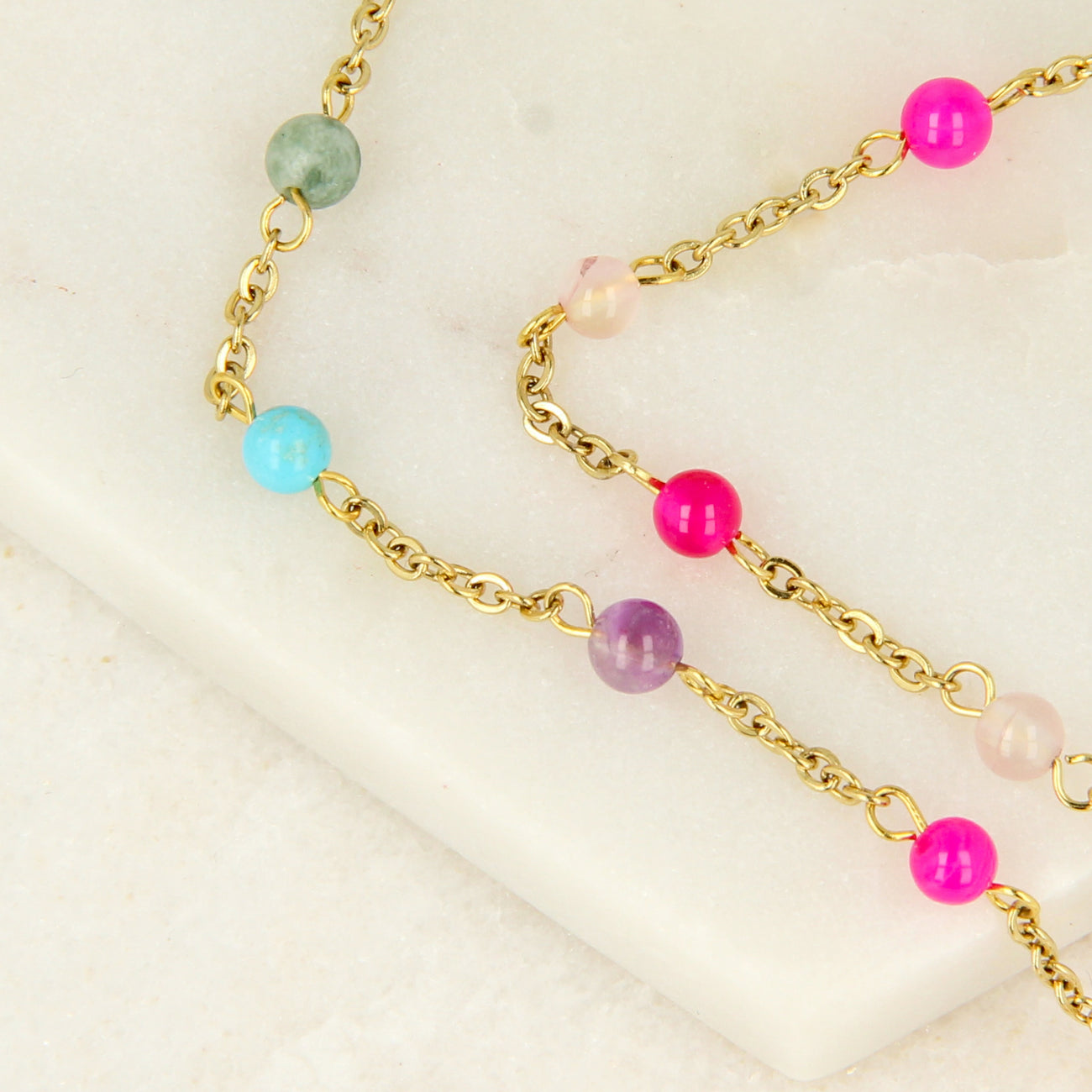 Golden bracelet with colorful gemstones