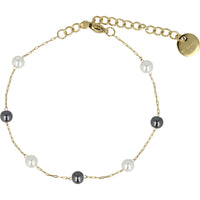 Goldenes Armband mit schwarzen und weißen Perlen